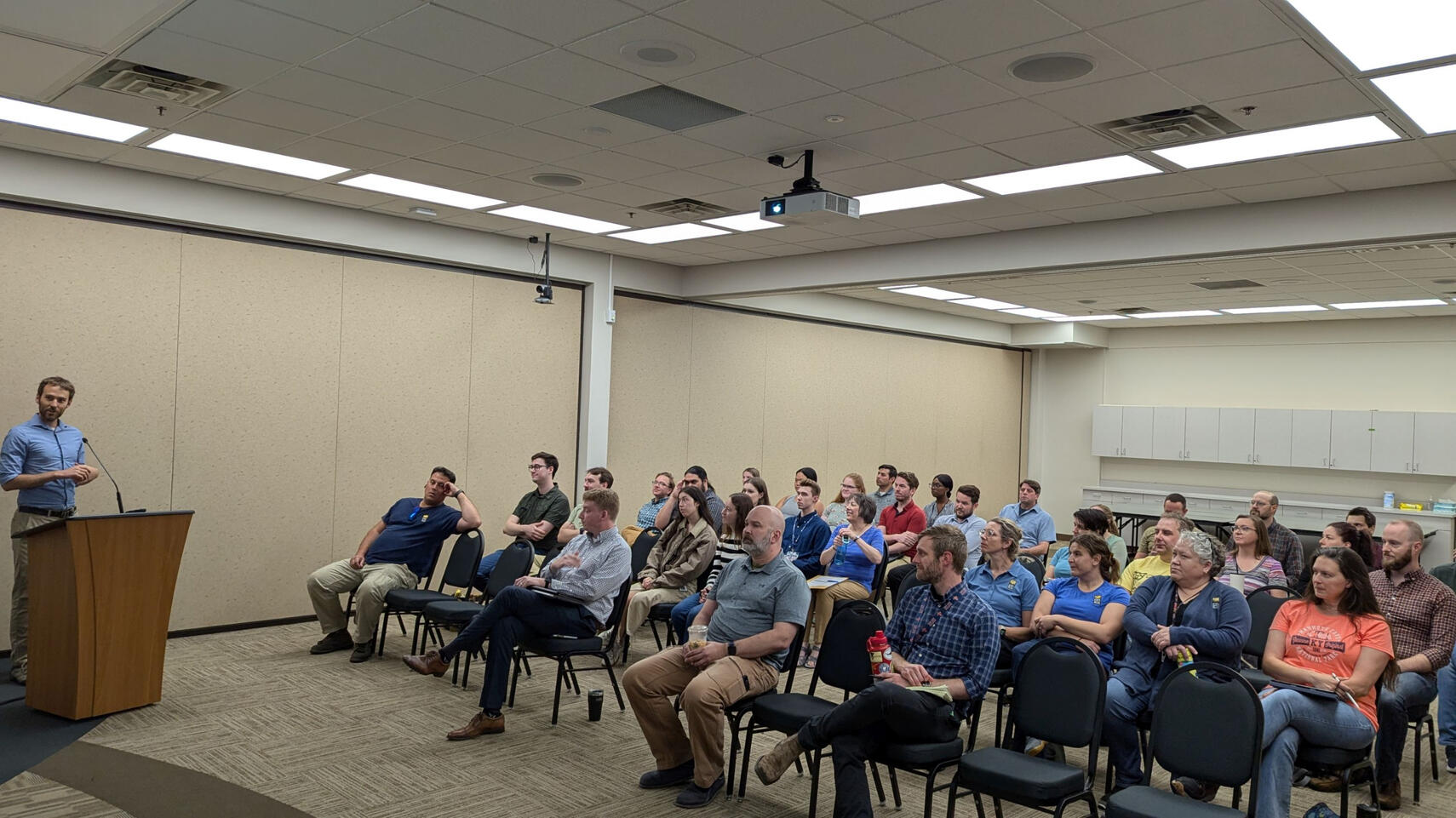 User group members attend an in-person meeting in the summer of 2024 in a meeting room at the City of Eden Prairie.